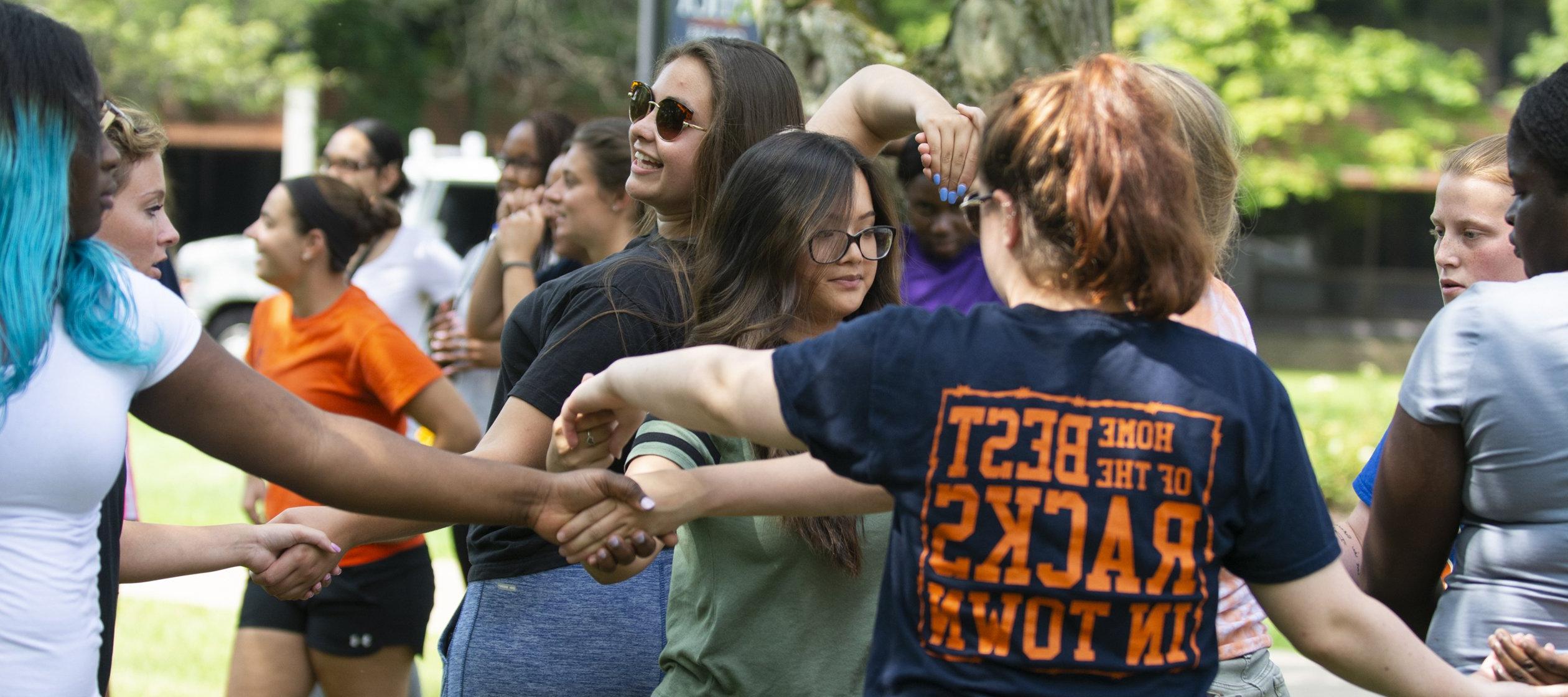 College Engagement - Students Holding Hands